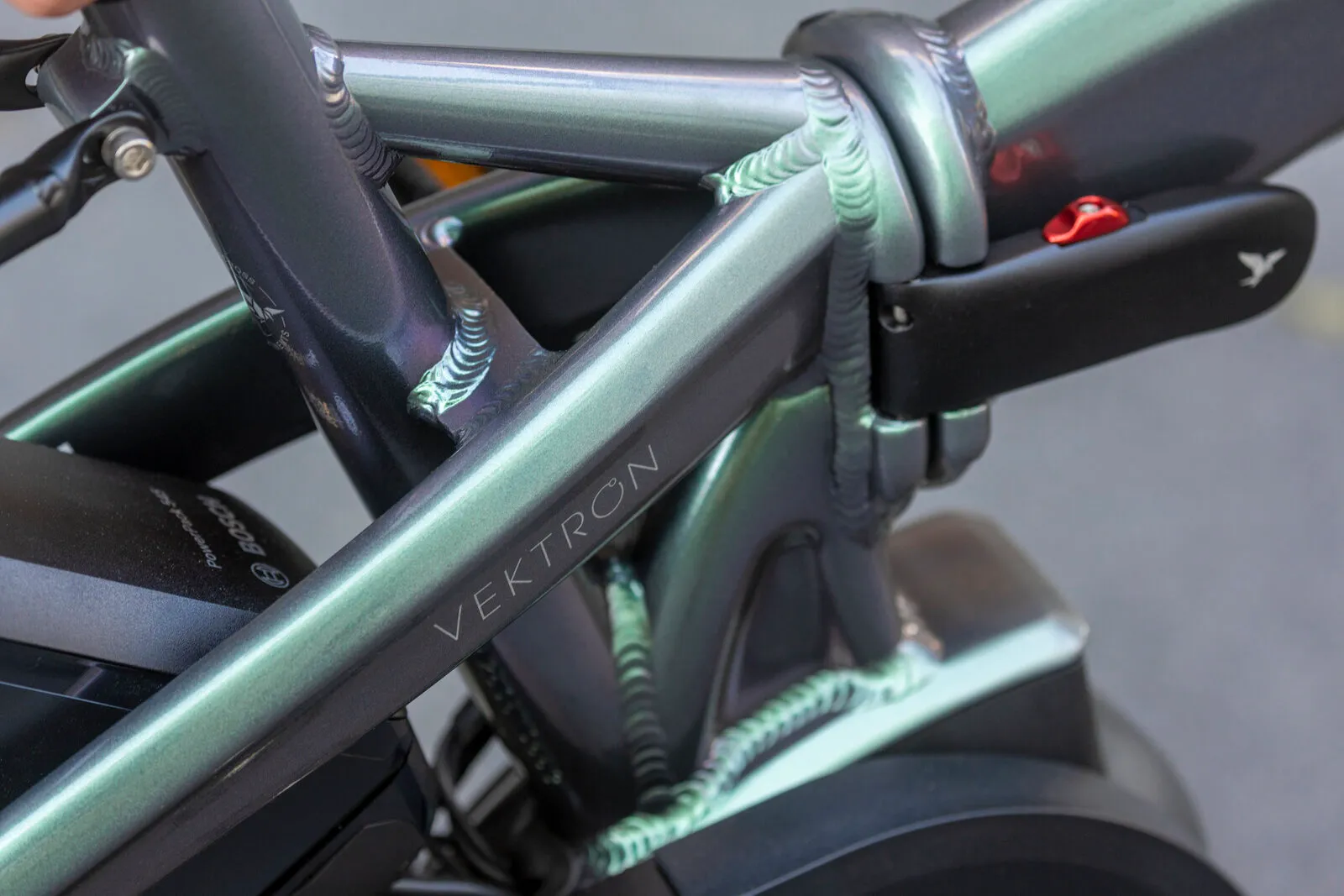 Frame detail on the folded Vektron in urban verdant.