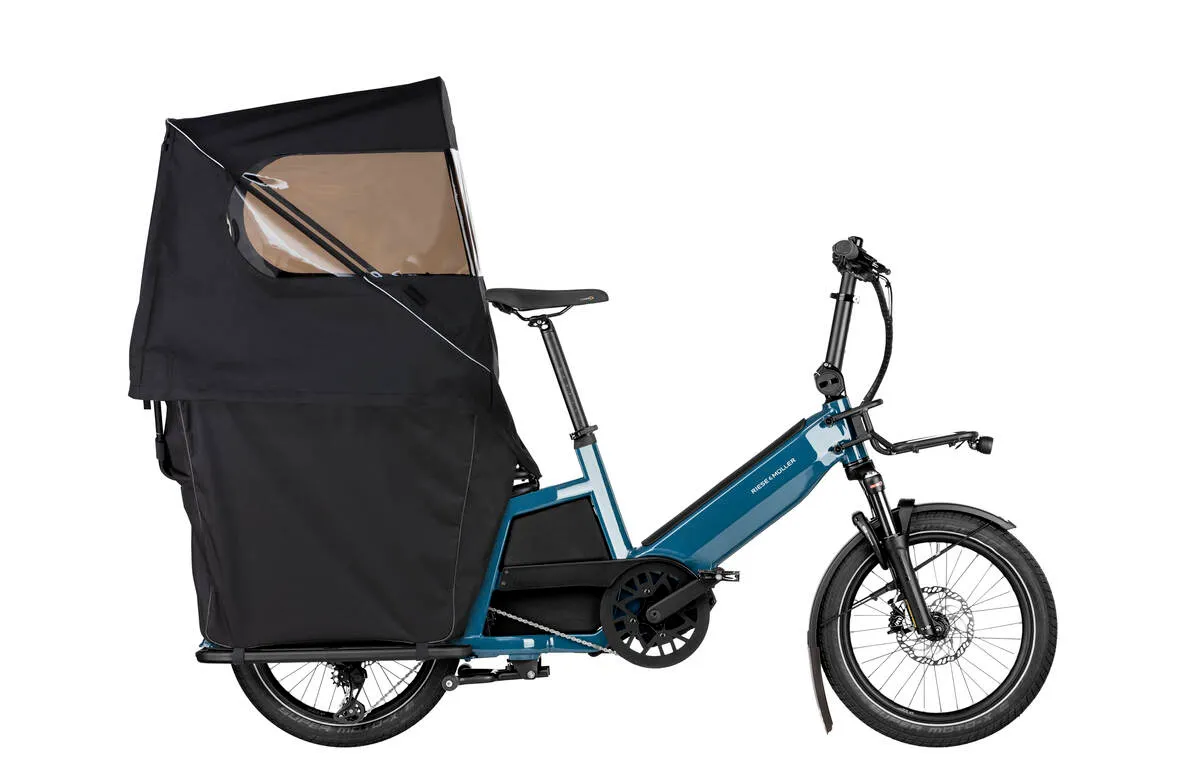 Riese & Müller Multitinker touring in petrol blue/black with safety bar kit and complete weather protection.