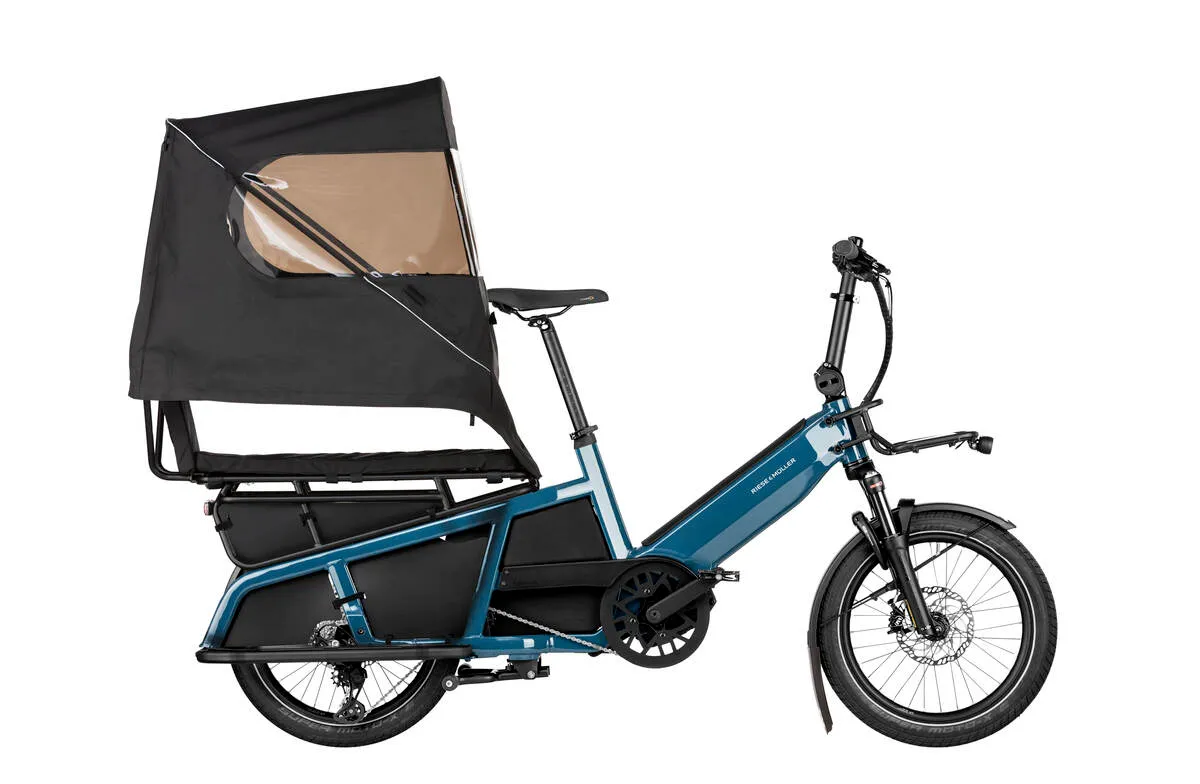 Riese & Müller Multitinker touring in petrol blue/black with safety bar kit and top weather protection.