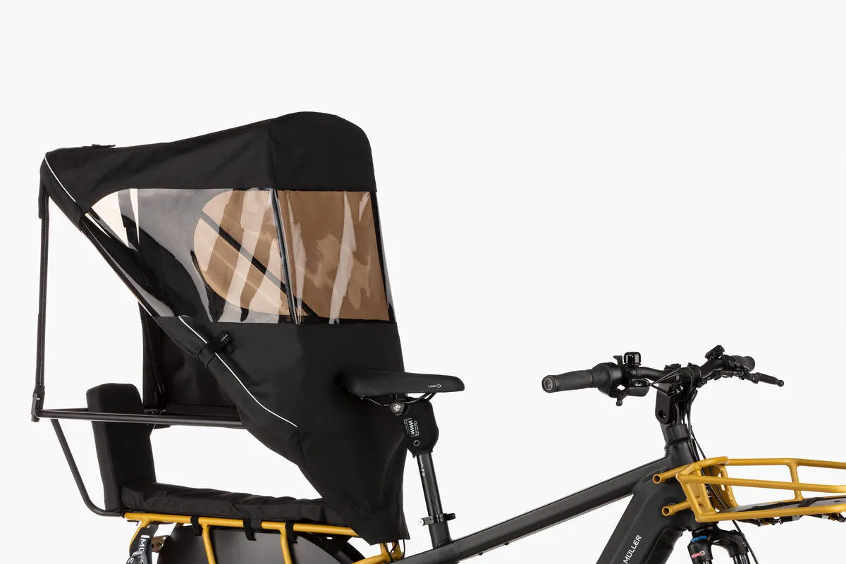 Close-up of Riese & Müller Multicharger2 GT vario in utility grey with carrier in curry matt and top weather protection.