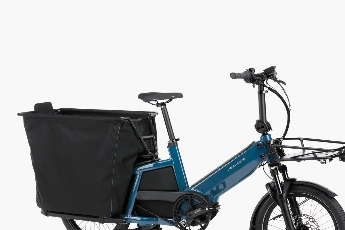 Riese & Müller Multitinker touring in petrol blue/black with safety bar kit and bottom weather protection close-up.