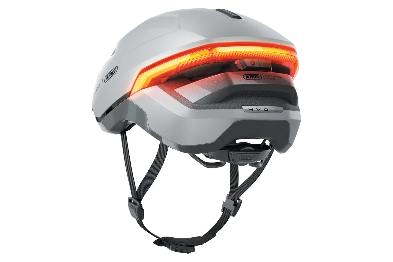ABUS HYP-E helmet in gleam silver, three-quarter rear view showing indicator lights