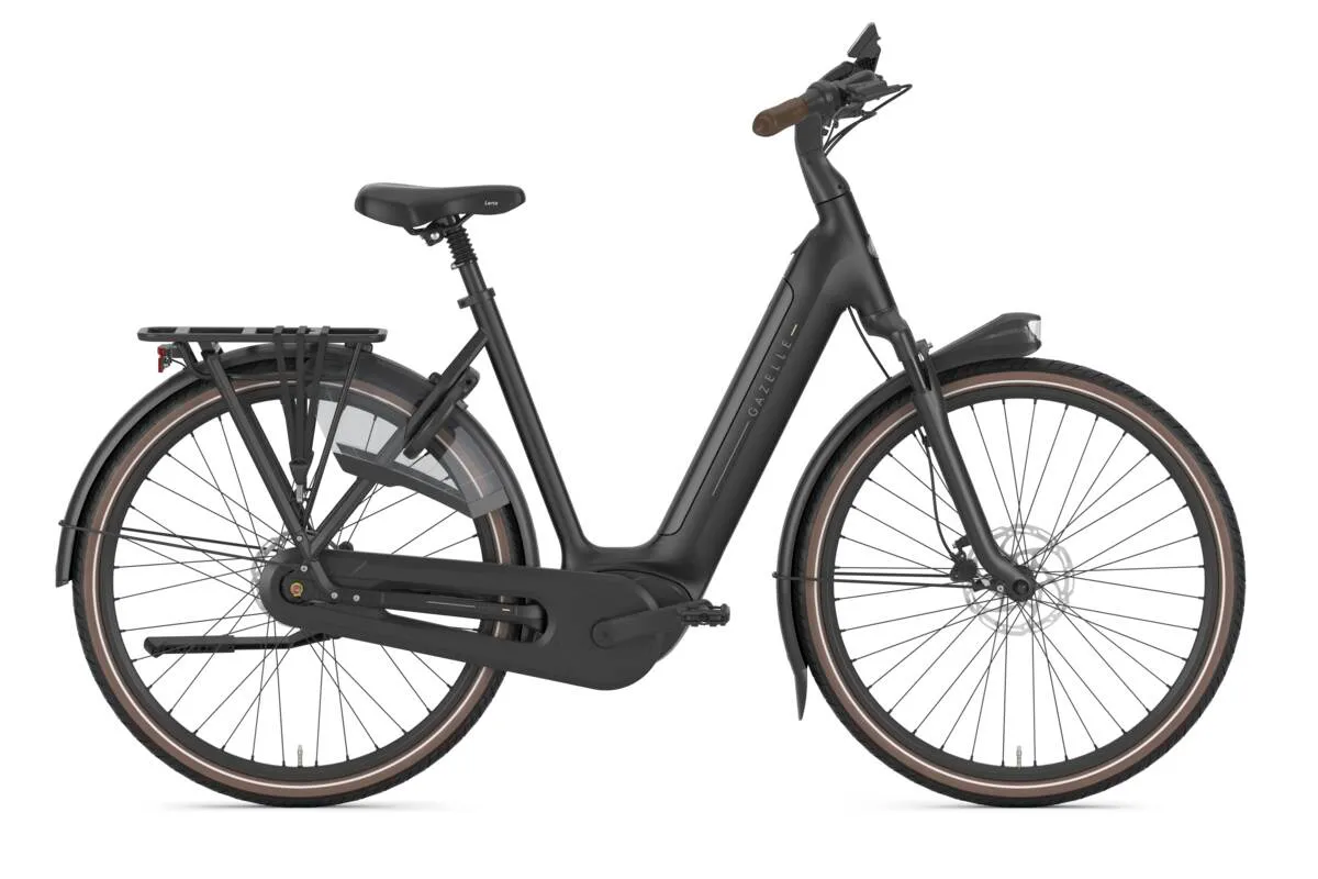Gazelle Grenoble C8 e-bike with step-through frame and brown tyre sidewalls in profile.
