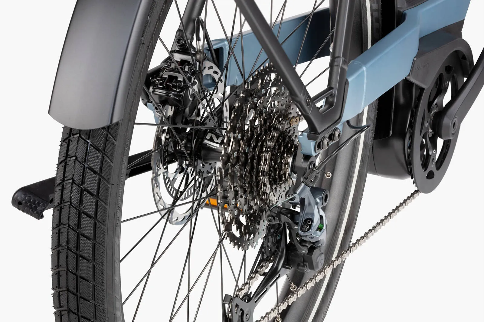 A cyclist riding the Nevo5 through an urban environment.