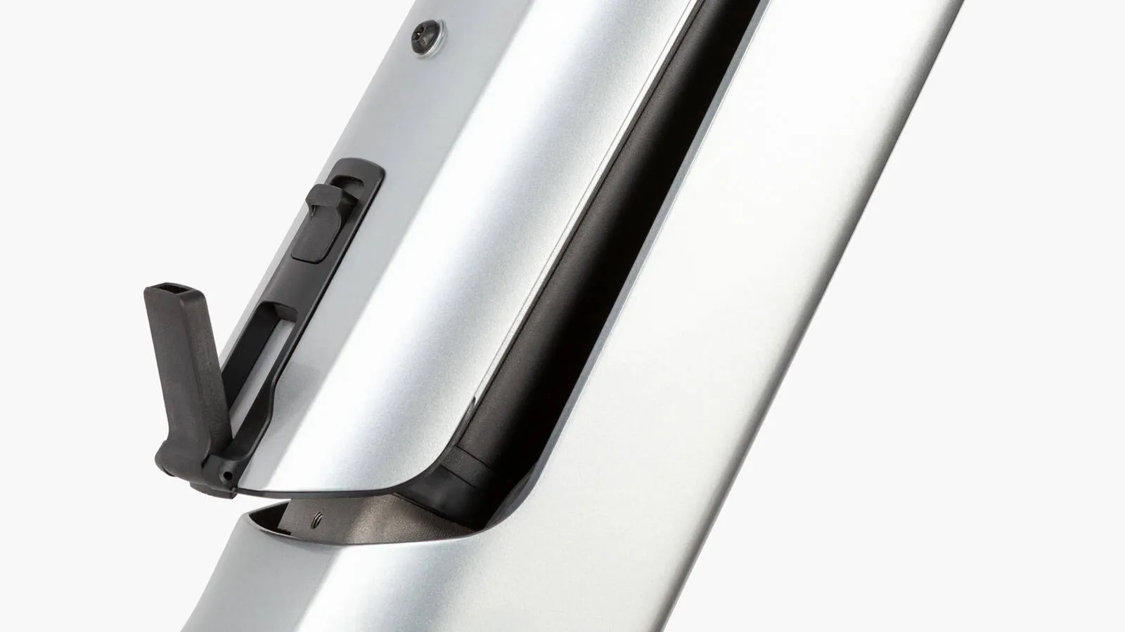 A cyclist enjoying the Riese & Müller Charger5 on a city street with urban architecture.