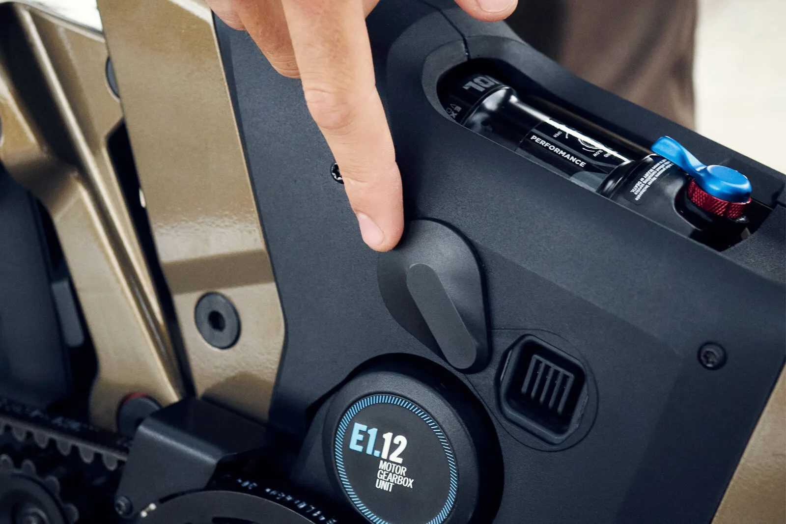 Close-up of the Pinion E1.12 motor gearbox unit with integrated tool storage compartment.