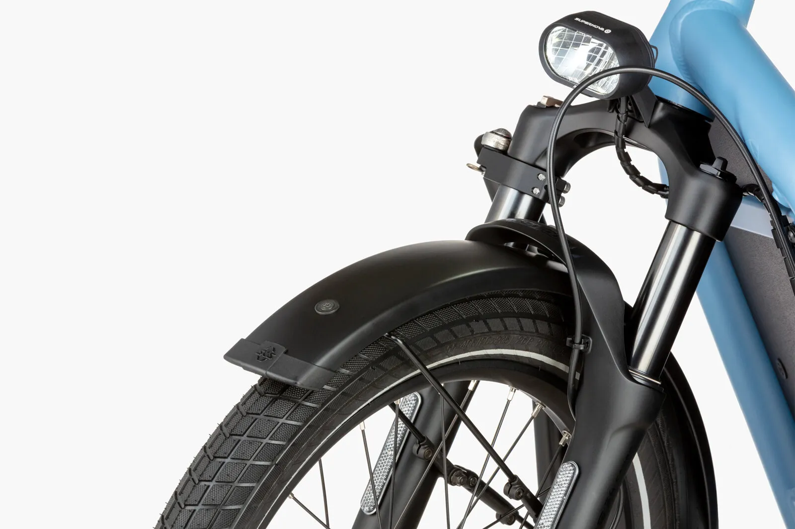 Close-up of the Load5 60 front suspension fork and integrated headlight.
