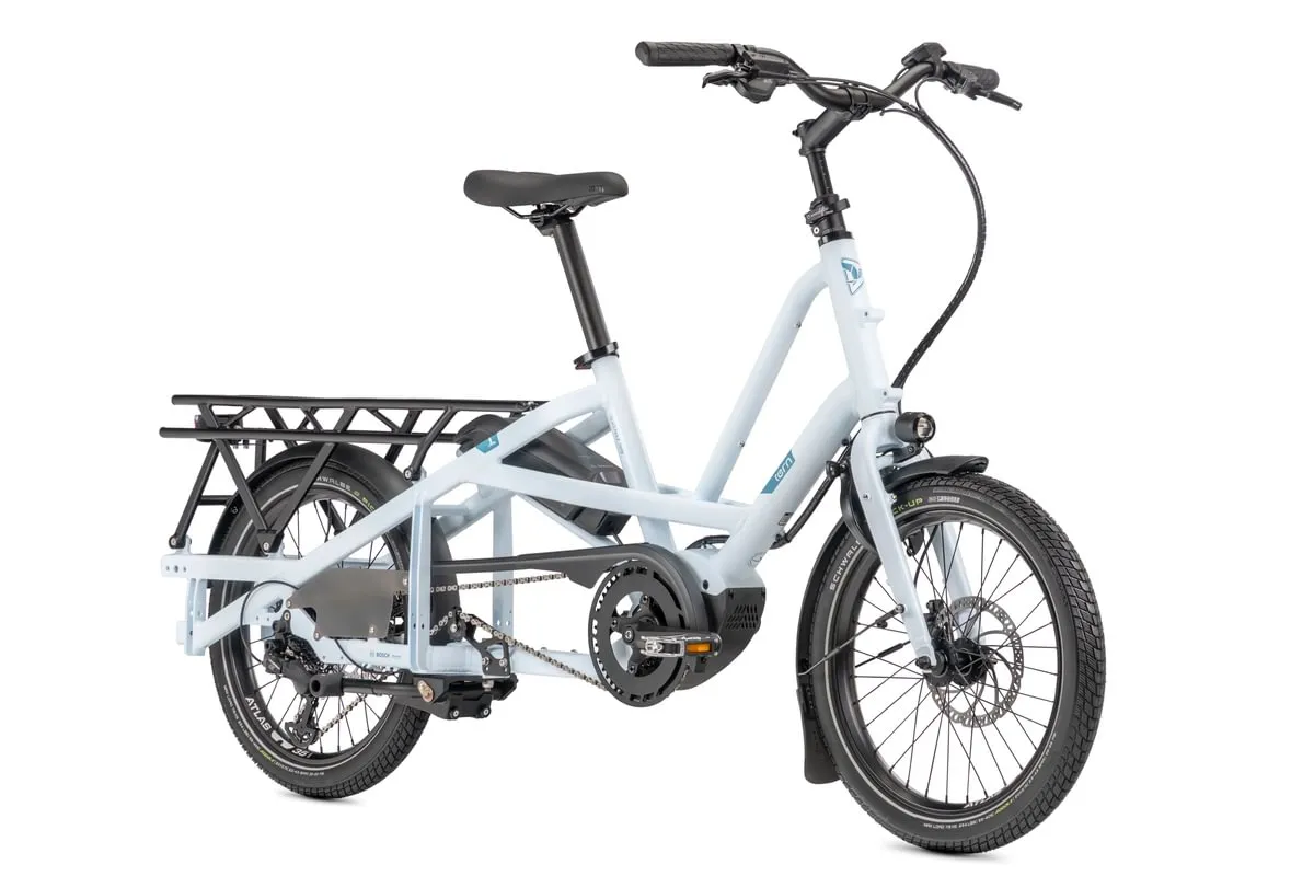 White Tern Quick Haul Long e-bike with extended rear deck platforms in open position, demonstrating versatile cargo and passenger setup