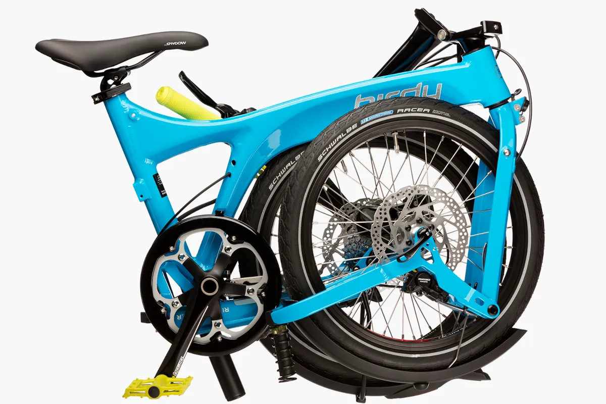 Riese & Müller Birdy touring in cyan folded down.