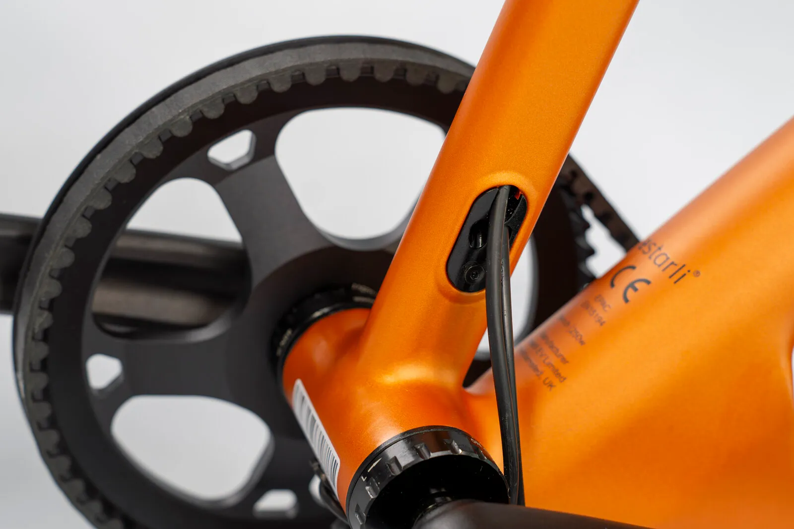 Close-up of the e20.X frame showing the charging port and belt drive.