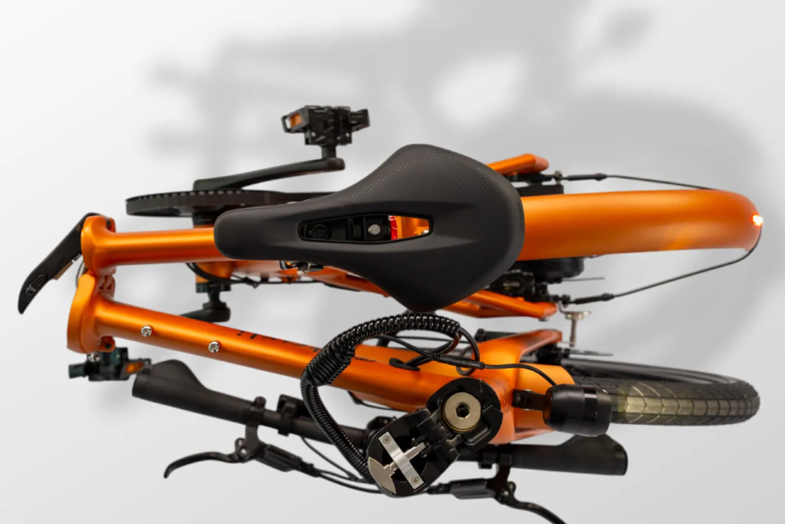 Estarli e20.X in bronze, folded compactly showing integrated rear light.