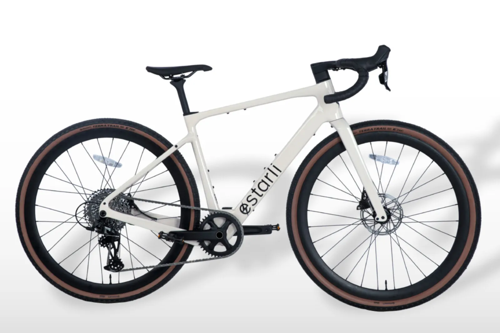 Estarli G700 in lunar white with tan-wall gravel tyres, side profile view.