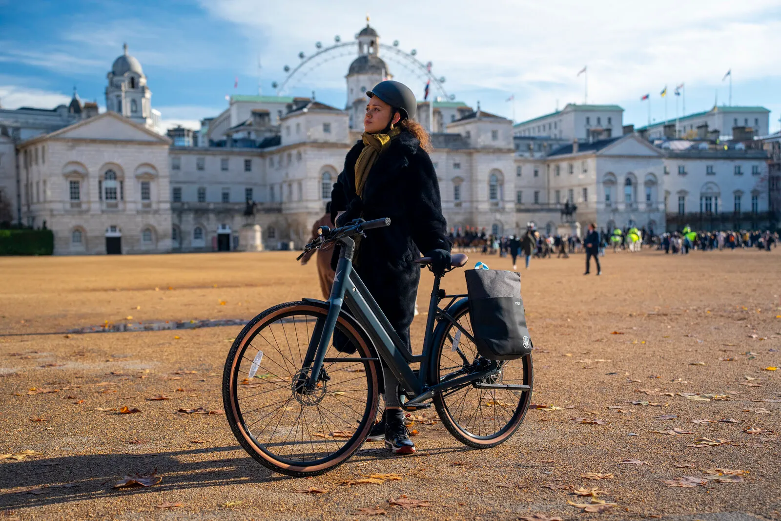 A woman with the Estarli e28.X step-through at Horse Guards Parade in London.