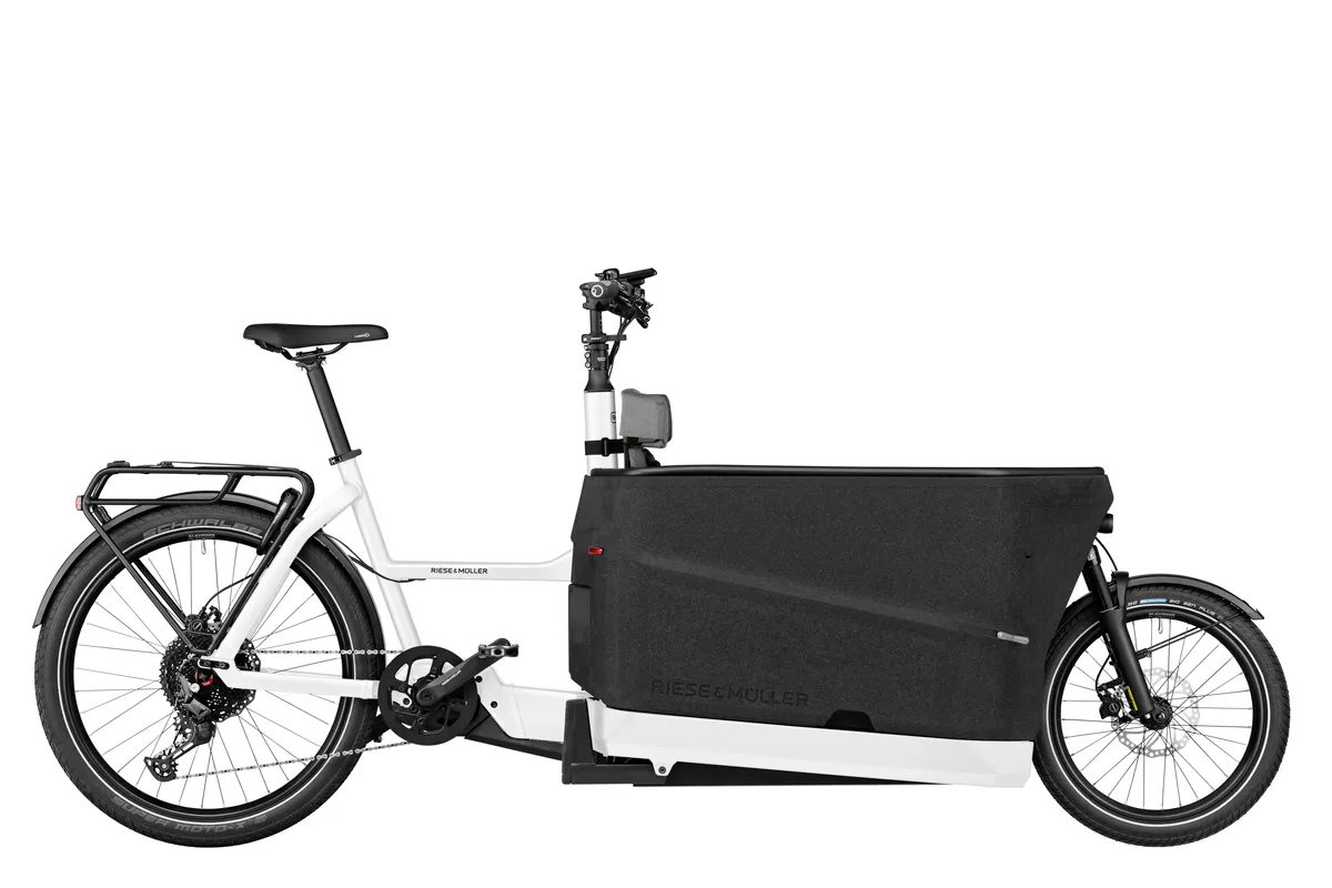 Riese & Müller Packster2 70 touring in white with double rear child seat and pannier rack.