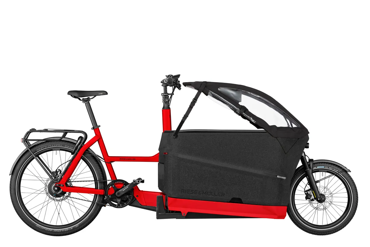 Riese & Müller Packster2 70 vario in chili matt with child cover and pannier rack.