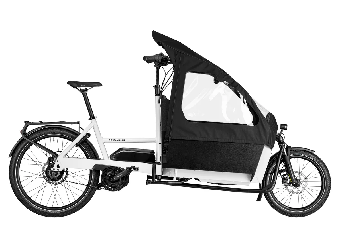 Riese & Müller Transporter2 65 vario in true white with box, double rear child seat and child cover.