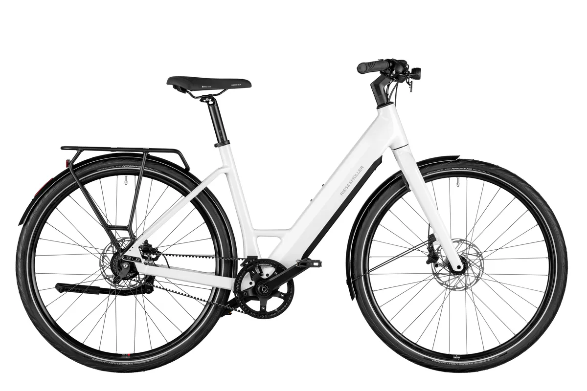 Riese & Müller UBN Six silent in pure white with comfort kit and carrier.