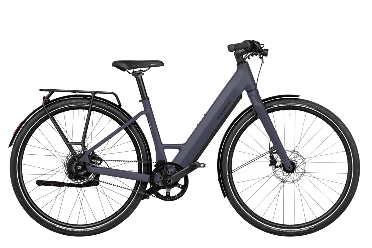 Riese & Müller UBN Six vario in night with comfort kit and carrier.